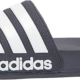 Pair of Adidas Adilette shower slides in black with white iconic three stripes.